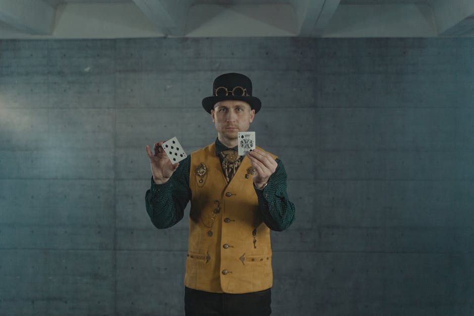 A man in steampunk attire showcasing card tricks indoors.